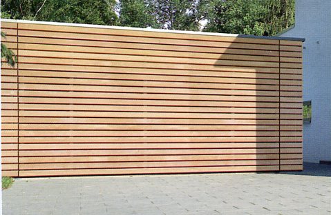 Picture ALR sectional garage door with  on-site cladding     